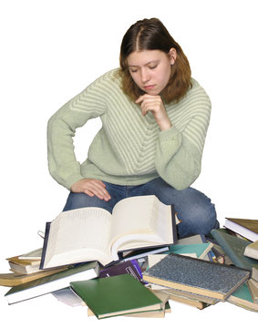 student girl reading on the heap of books