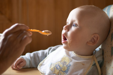 baby boy eating from a spoon