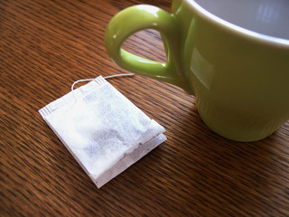cup and teabag on the wooden table