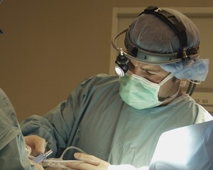 surgeon with headlamp