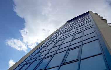 Fototapeta na wymiar modern building with cloudy sky
