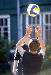 boys play volley ball