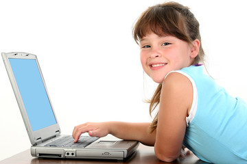 little girl working on laptop