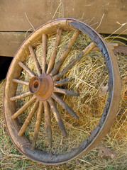 broken stagecoach wheel, portrait view