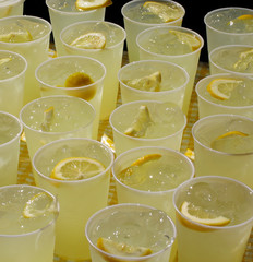 cups of lemonade on yellow gingham tablecloth