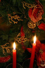 two candlelights and one christmas wreath