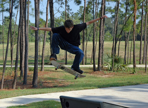 soaring teen skateboarder