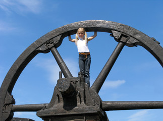 little girl and large wheel