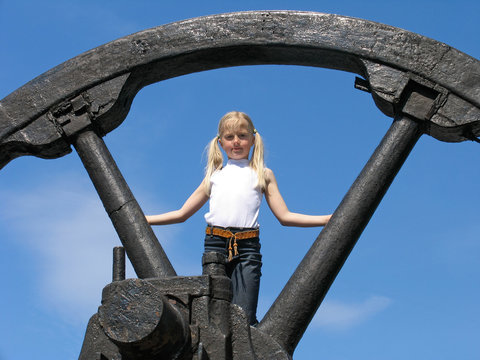 Little Girl And Large Wheel