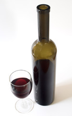 bottle of red wine and full glass (top view)
