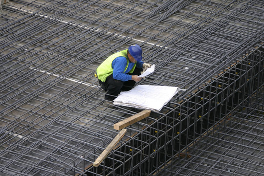 Project Manager Reading The Site Plans