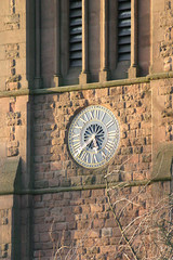 Fototapeta na wymiar church clock and winter trees