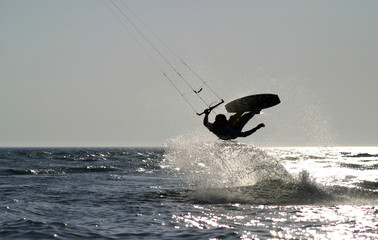 kite boarder jumping on the ocean