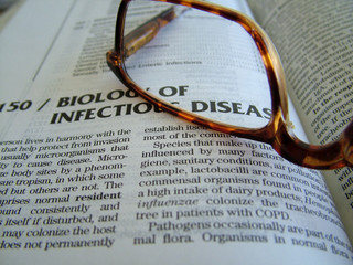 medical book and glasses