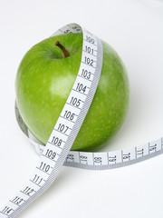 Apple with measuring tape. - 137424