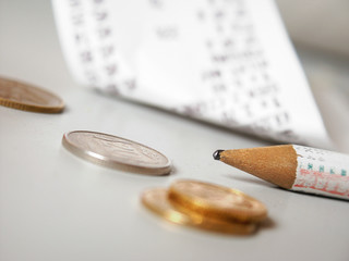 Store bill, pencil and coins.
Soft focus view. - 137648