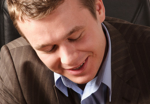 positive and shy  smiling young man