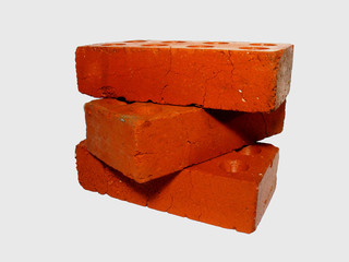 three red bricks on a white background