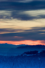 Fototapeta na wymiar winter sunset with blurred horizon, vertical