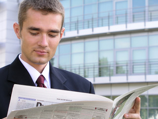 businessman reading newspaper