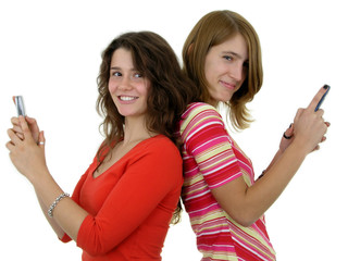 two girls using mobile phones