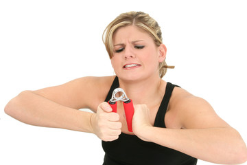 young woman struggling with hand grips