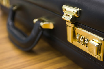 closeup of briefcase: lock in focus