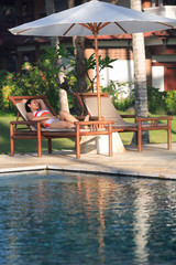 tourist relaxing by a swimming pool
