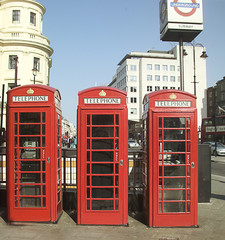 Fototapeta na wymiar three british telephone boxes