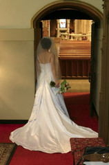 bride waiting to enter the church - soft focus