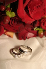 wedding band, rings and red roses