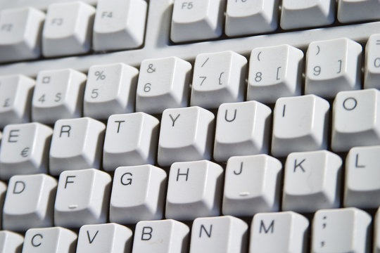 white desktop computer keyboard