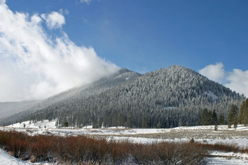 cloud on snowy mountain