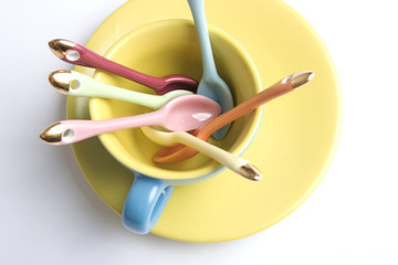 coloured spoons in a coloured cup