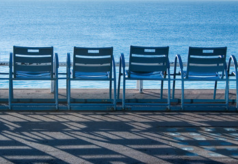 blue chairs in nice, france