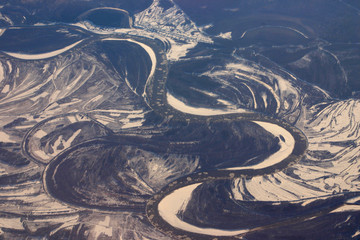 aerial view of ice shoals floating in a river