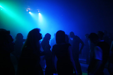 silhouettes of dancing people
