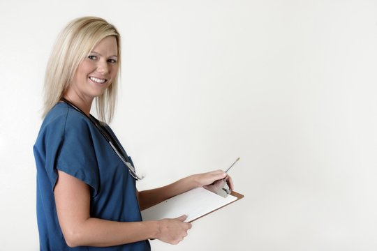 Pretty Nurse Holding Chart Over White