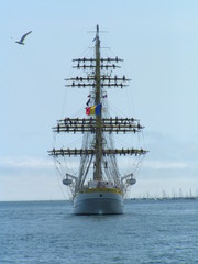 Fototapeta na wymiar tall ship with crew on yards