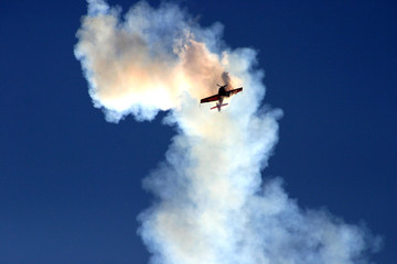 plane in the cloud of smoke