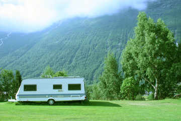 modern caravan at the campsite in the mountains - obrazy, fototapety, plakaty