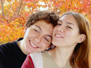 autumn portrait of 2 teenagers