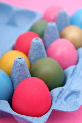 Fototapeta na wymiar colorful easter eggs in carton