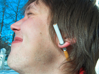 the guy with a cigarette in an ear