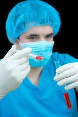 medical worker examining a blood