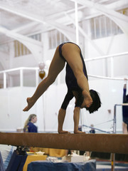 gymnast competing on beam