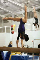 gymnast competing on beam