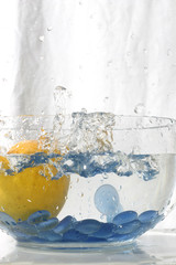 juicy citron splashing into water