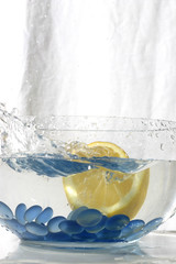 juicy citron splashing into water