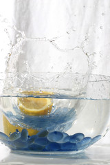 juicy citron splashing into water